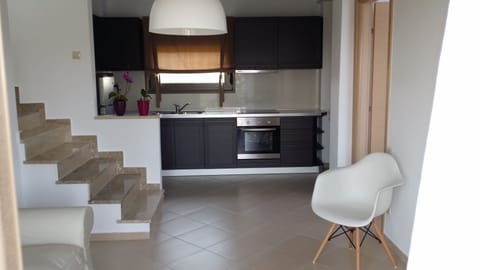 Deluxe Duplex, 2 Bedrooms | Private kitchen | Full-size fridge, oven, stovetop, coffee/tea maker