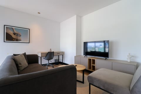 Bright living room with modern sofa and TV