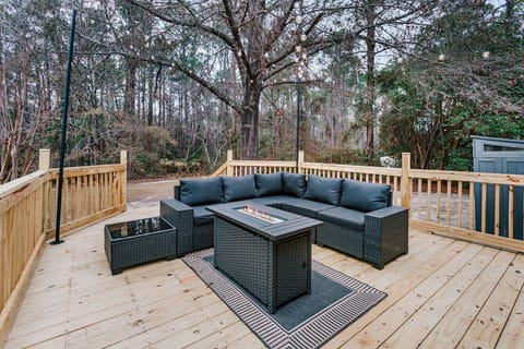 Relaxed outdoor lounge designed for conversation, fresh air, and unwinding under the trees.