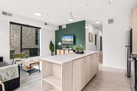 Open-concept layout connecting the living room and kitchen — ideal for socializing while cooking or enjoying a meal.