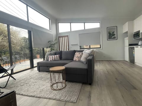 Large - open plan living/dining area - heaps of sunlight (block out blinds) and high ceilings.

Big comfy lounge with a single occasional chair :)