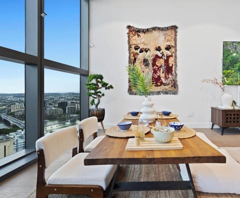 Spacious chabudai table with zaisu floor chairs, set against serene views of the river, city, and Mount Coot-tha. Start your day with a calming matcha or enjoy meals with authentic Japanese cutlery for a true cultural experience