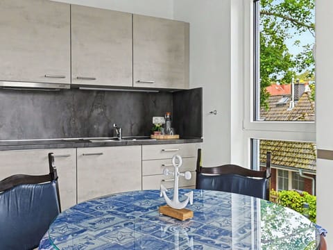 Furniture, Flooring, Kitchen, Countertop, Interior Design, Floor, Kitchen Appliance, Lighting, Home, Cabinetry