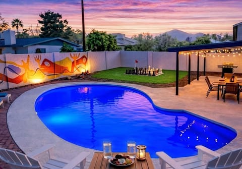 Private heated pool, giant chess & backyard oasis at sunset