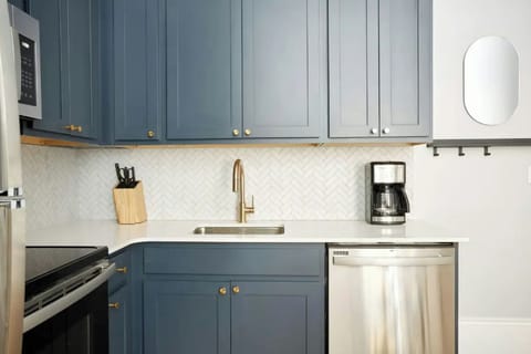 Fully equipped kitchen area with ample counter space.