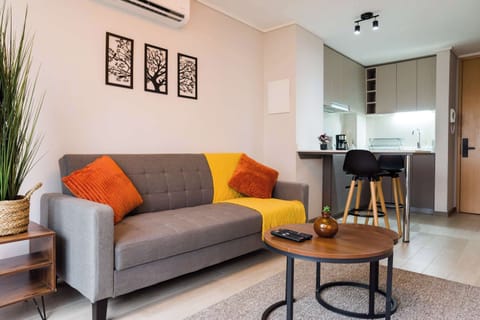 Modern and cozy living space with a stylish kitchen corner, perfect for unwinding after city adventures.