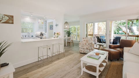View of your living room, kitchen, dining and private deck.