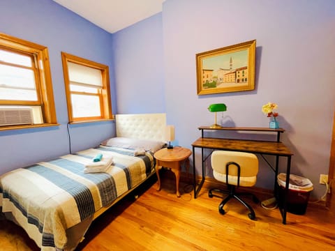 Bedroom 1 has a full size bed and work station