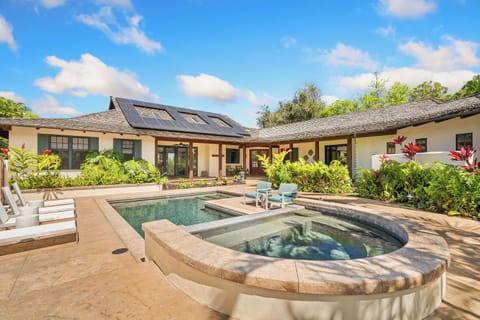 Villa opens up to a private courtyard featuring our saltwater pool and spillover heated spa, four chaise lounges provided as well as other tables to sit and play cards, BBQ located on the courtyard lanai too