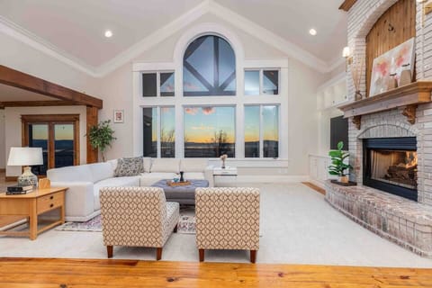 Bright and roomy living space with a warm fireplace for memorable family moments.