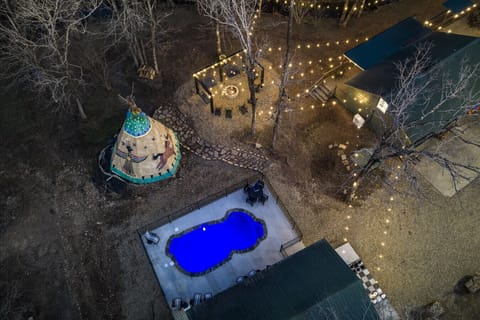 Take it all in from above—this one-of-a-kind property is designed like your own private resort in the heart of Broken Bow.