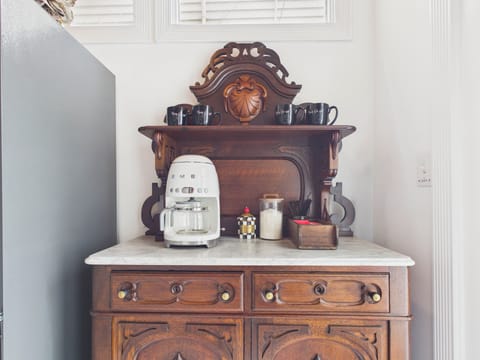 Start your morning the slow, Southern way. Brew a fresh cup, settle into the quiet charm of this vintage coffee nook, and let the warmth of home and history ease you into the day at Maison De 1886.