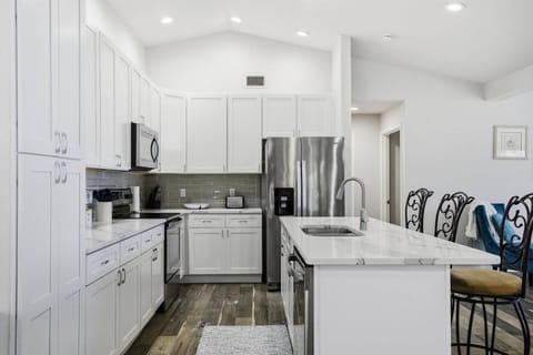 Fully equipped kitchen with modern appliances, ample counter space, and everything needed to cook and dine just like home.