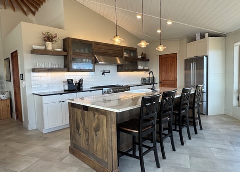 Kitchen features Bertazonni appliances, an 11 foot island, walk-in pantry