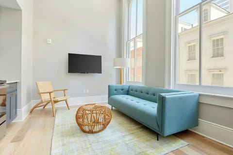 Living area with plush seating and a TV for entertainment. 