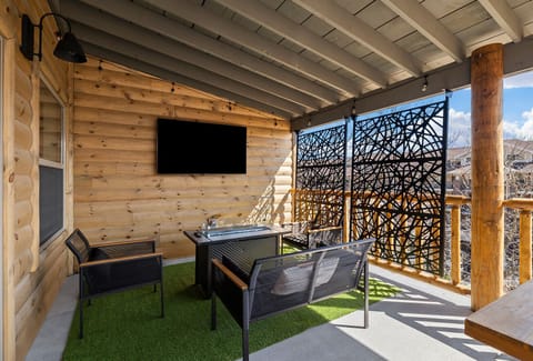 Propane firepit outside with an outdoor TV!