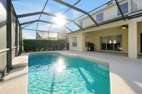 Private pool with covered outdoor area for relaxing anytime.