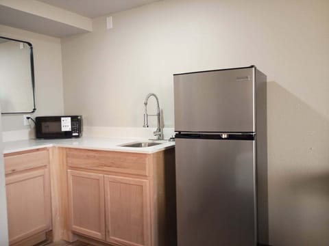 Deluxe Room | Private kitchen | Full-size fridge, microwave