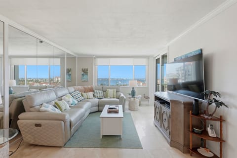 Bright and inviting, the living room is filled with natural light and offers a comfortable space to relax, stream your favorite shows, or unwind together while enjoying the coastal bay area ambiance.