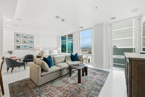 Floor-to-ceiling windows showcasing sweeping city and horizon views