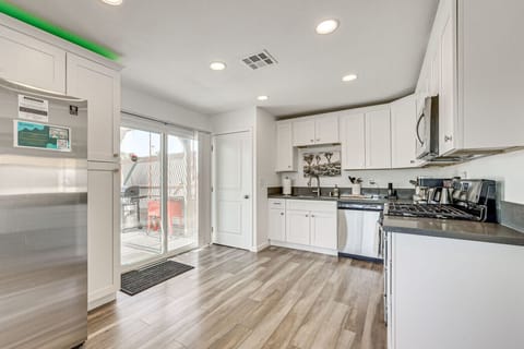 Kitchen | Stainless Steel Appliances | White Cabinetry & Recessed Lighting
