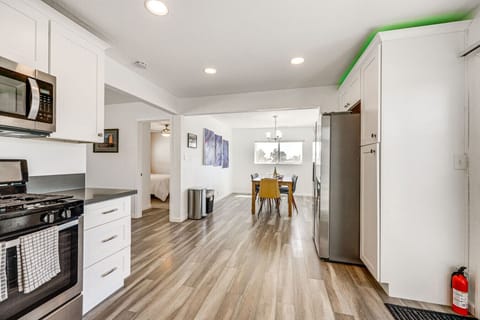 Kitchen | Stainless Steel Appliances | White Cabinetry & Recessed Lighting