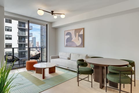 Bright living room with smart TV and balcony access