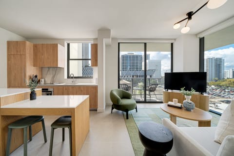 Bright open-concept living space with floor-to-ceiling windows.