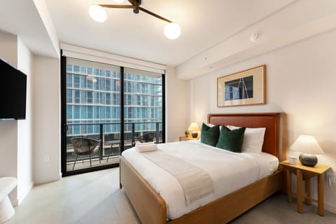 Serene bedroom with floor-to-ceiling windows