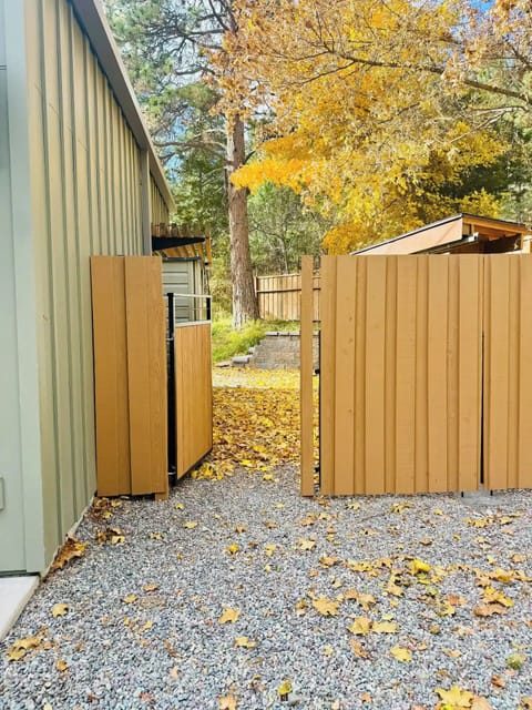 Unlatch the gate by reaching over it