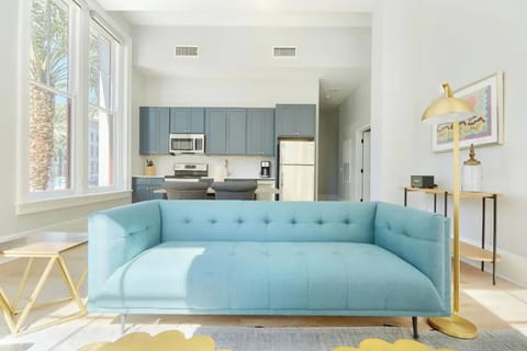 Bright and airy living room with plush seating and a TV to keep you entertained.