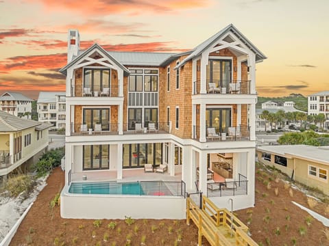 Modern beachside luxury home featuring multiple levels, private pool, and contemporary architecture set in a scenic coastal neighborhood.