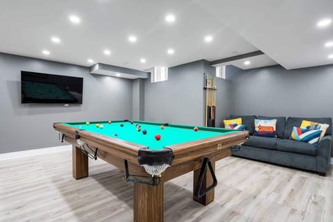 Our beautiful game room with Pool table, Foosball table and TV