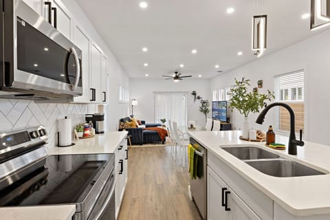 From kitchen to living room - an open, light-filled layout designed for the way groups actually live together.