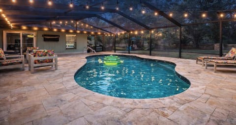 Heated private PebbleTec pool inside screened lanai