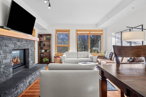 Living space with mountain views and fireplace.