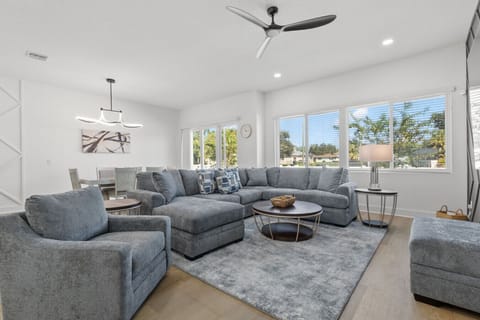 View of living and dining area with back patio access