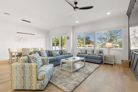 View of living and dining area with back patio access