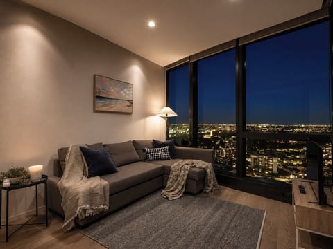 The living room is adorned with gorgeous views, a smart TV and a sofa bed (setup available on request).