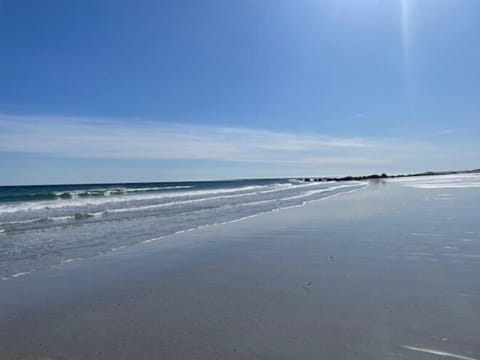 Beach nearby, white sand, beach towels, fishing