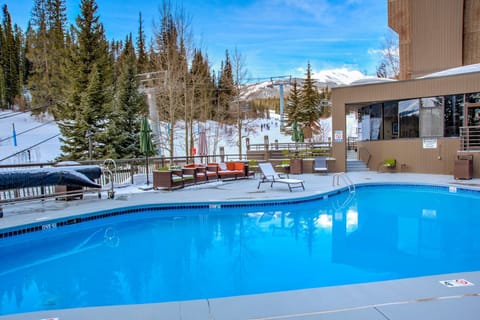 Sparkling outdoor pool with mountain scenery.