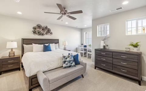 Fully furnished master bedroom with drawers, a study desk, bed bench, and plenty of thoughtful details.