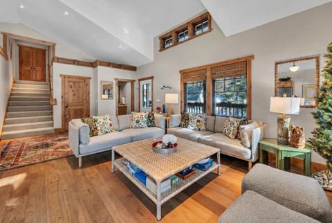Living Room: Smart Tv, Sofa seating and access to private deck