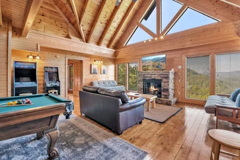 just one of two living rooms. this one on the second floor with arcades and pool table, and electric fireplace.