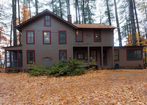 Driveway entrance, North side. Enter to kitchen and porch.