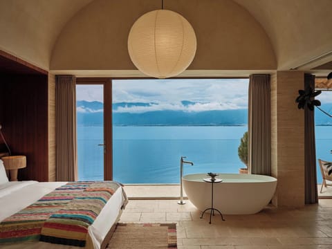Classic Double Room, Patio, Sea View | Minibar (free items), desk, laptop workspace, blackout drapes