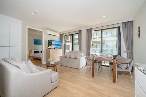 Deluxe Apartment, 2 Bedrooms, Balcony | Living room | 55-inch Smart TV with cable channels