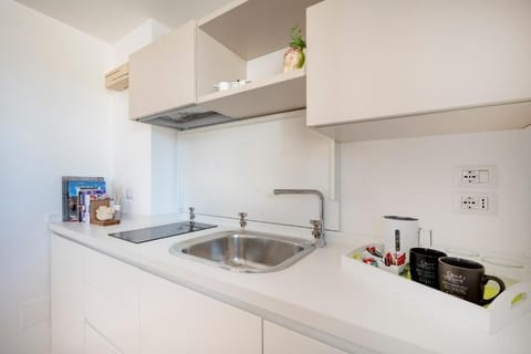Family Suite, City View | Private kitchen | Espresso maker, coffee/tea maker, electric kettle