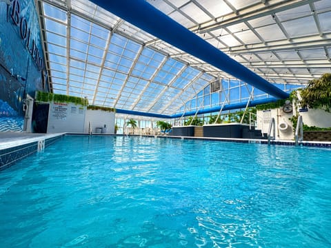 Indoor pool, seasonal outdoor pool, open 9 AM to 11 PM, sun loungers