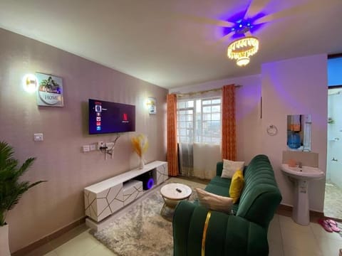 Apartment, Balcony, City View | Living area | Flat-screen TV